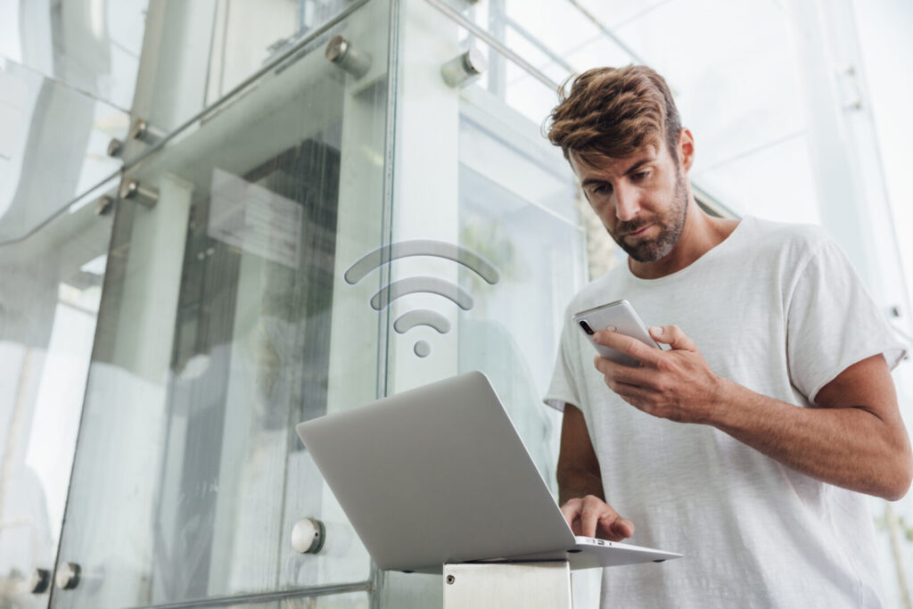bearded man checking portable device